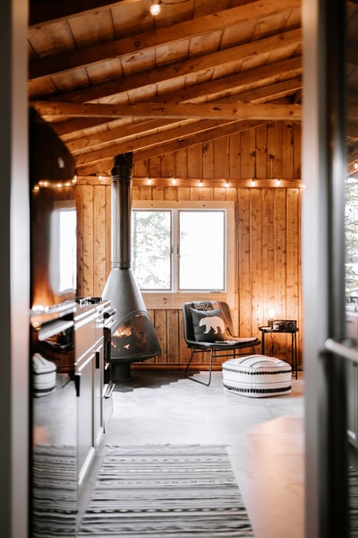 black leather padded chair beside brown wooden table